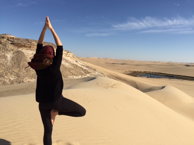 Yoga Above the Oasis during a women-only Siwa wellness retreat